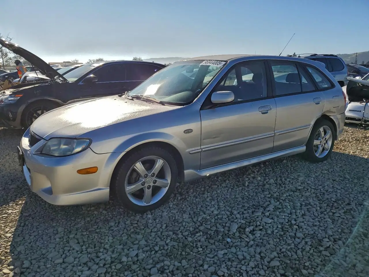 MAZDA PROTEGE 2003. Lot# 96944005. VIN JM1BJ245431221008. Photo 1