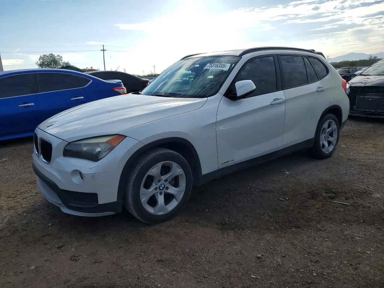 BMW X1 2015. Lot# 75316385. VIN WBAVM1C53FV314533. Photo 1