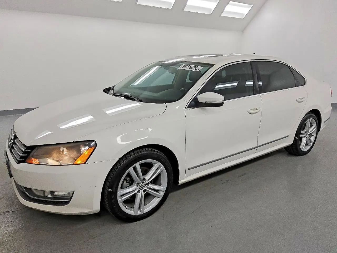 VOLKSWAGEN PASSAT 2012. Lot# 98218095. VIN 1VWCM7A37CC044645. Photo 1