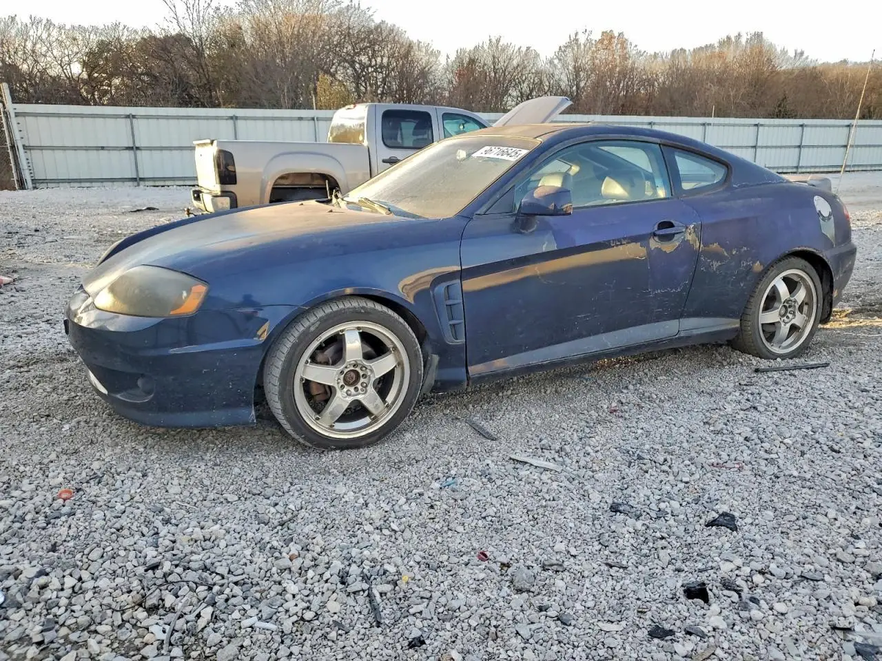 HYUNDAI TIBURON 2005. Lot# 96716645. VIN KMHHN65FX5U159785. Photo 1