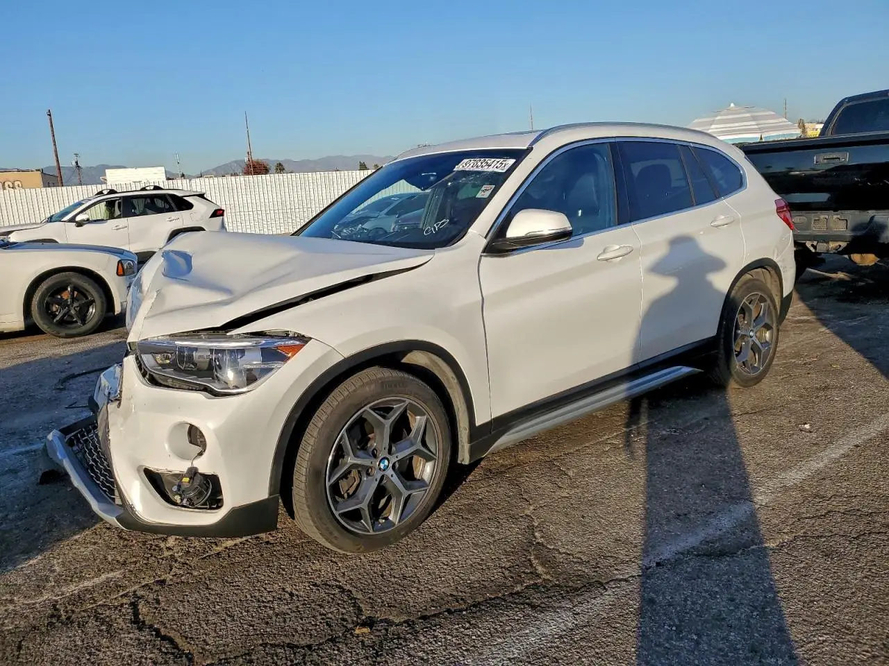 BMW X1 2018. Lot# 97035415. VIN WBXHU7C3XJ5L08080. Photo 1